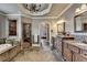 Beautiful bathroom featuring stone floors, double vanity, shower and soaking tub at 5340 Cole Creek Ln, Cumming, GA 30040