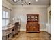 Bright office space featuring a wooden desk, hutch, neutral paint, and contemporary lighting at 5340 Cole Creek Ln, Cumming, GA 30040