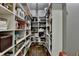 Walk-in pantry with ample shelving, providing generous storage space at 5340 Cole Creek Ln, Cumming, GA 30040