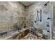 Walk-in shower with pebble floor, bench, and rain shower head at 5340 Cole Creek Ln, Cumming, GA 30040