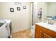 Bathroom/laundry room area with washer/dryer hookups, sink, and vanity at 885 Green Valley Dr Nw, Conyers, GA 30012
