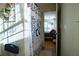 Bathroom view with shower curtain, a glimpse into the bedroom, and natural light at 885 Green Valley Dr Nw, Conyers, GA 30012