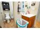 This bathroom includes a toilet, sink, and vanity at 885 Green Valley Dr Nw, Conyers, GA 30012
