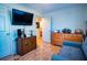 Bedroom with hardwood floors, TV, and closet at 885 Green Valley Dr Nw, Conyers, GA 30012