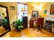 Bedroom with hardwood floors, large mirror, vanity, and natural light from the window at 885 Green Valley Dr Nw, Conyers, GA 30012