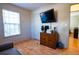 Bedroom with hardwood floors and nice natural light through the window at 885 Green Valley Dr Nw, Conyers, GA 30012