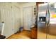 Mud room entryway featuring coat closet, exterior door, and a stainless steel refrigerator at 885 Green Valley Dr Nw, Conyers, GA 30012