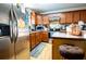 Eat good sign in this cozy kitchen with stainless steel appliances, wood cabinets, and a breakfast bar at 885 Green Valley Dr Nw, Conyers, GA 30012