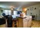 Open floor plan featuring living room, dining area, and kitchen island with bar stool seating at 885 Green Valley Dr Nw, Conyers, GA 30012