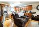 Spacious living space with hardwood floors featuring stainless appliances and comfortable seating at 885 Green Valley Dr Nw, Conyers, GA 30012