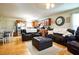 Open-concept living space featuring hardwood floors, kitchen with stainless appliances and comfortable seating at 885 Green Valley Dr Nw, Conyers, GA 30012