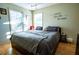 Bedroom with a cozy bed, natural light from windows, and 'Always Kiss Me Goodnight' wall decor at 885 Green Valley Dr Nw, Conyers, GA 30012