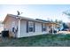 View of home showcasing clean siding and a covered porch with seating area at 885 Green Valley Dr Nw, Conyers, GA 30012