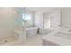 Bright bathroom with double vanity, soaking tub and glass enclosed shower at 891 Pine Way, Dallas, GA 30157