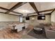 Finished basement with a pool table, stone accent wall, and a cozy seating area for entertainment at 2110 Se Murren Se Dr, Smyrna, GA 30080