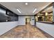 Finished basement with dark stained floors, bar area, and media room at 2110 Se Murren Se Dr, Smyrna, GA 30080