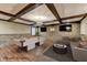 Finished basement with a pool table, stone accent wall, and a cozy seating area for entertainment at 2110 Se Murren Se Dr, Smyrna, GA 30080