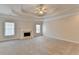 Spacious bedroom features a cozy fireplace, tray ceilings, and plush carpeting at 2110 Se Murren Se Dr, Smyrna, GA 30080
