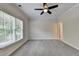 Bedroom featuring natural light from a window, ceiling fan and neutral walls at 2110 Se Murren Se Dr, Smyrna, GA 30080