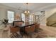 Elegant dining room featuring a wooden table, modern chairs, and natural light, ideal for gatherings and meals at 2110 Se Murren Se Dr, Smyrna, GA 30080