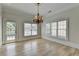 Bright dining room featuring large windows, natural light, and hardwood floors at 2110 Se Murren Se Dr, Smyrna, GA 30080
