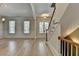 Inviting foyer with hardwood floors, staircase, and natural light from the front door at 2110 Se Murren Se Dr, Smyrna, GA 30080