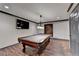 Spacious game room with a beautiful wood floor, dark trim and a mounted TV at 2110 Se Murren Se Dr, Smyrna, GA 30080