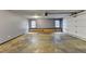 Spacious garage with concrete flooring, windows, and an automatic door at 2110 Se Murren Se Dr, Smyrna, GA 30080