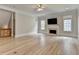 Spacious living room with fireplace, large windows, and neutral color palette at 2110 Se Murren Se Dr, Smyrna, GA 30080
