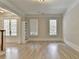 Bright living room featuring hardwood floors, neutral paint and modern trim throughout at 2110 Se Murren Se Dr, Smyrna, GA 30080