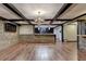 The living room has a stone accent wall, hardwood floors, and a wet bar at 2110 Se Murren Se Dr, Smyrna, GA 30080