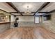 The living room has a stone accent wall, hardwood floors, and a wood burning stove at 2110 Se Murren Se Dr, Smyrna, GA 30080