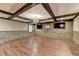 The living room has a stone accent wall, hardwood floors and coffered ceiling at 2110 Se Murren Se Dr, Smyrna, GA 30080
