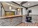 The wet bar area features stone accents, hardwood floors, and a wood burning stove at 2110 Se Murren Se Dr, Smyrna, GA 30080
