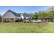 Beautiful lawn with pool, covered porch and an expansive manicured lawn at 281 Chilhoe Dr, Canton, GA 30115