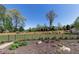 Beautifully landscaped backyard with a fence and lush green lawn at 281 Chilhoe Dr, Canton, GA 30115