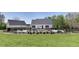 Stunning backyard featuring a private pool, lush lawn, and meticulously maintained landscaping surrounded by black aluminum fencing at 281 Chilhoe Dr, Canton, GA 30115