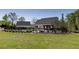 Expansive backyard with a pool, patio, pergola, and lush green lawn at 281 Chilhoe Dr, Canton, GA 30115