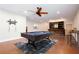 Finished basement with pool table, concrete floors, bar, and ceiling fan at 281 Chilhoe Dr, Canton, GA 30115