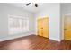 Cozy bedroom with hardwood floors, a window with blinds, and a closet at 281 Chilhoe Dr, Canton, GA 30115