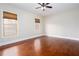 Empty bedroom featuring hardwood floors, base molding, and natural light at 281 Chilhoe Dr, Canton, GA 30115