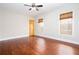 Empty bedroom with hardwood floors, base molding, and natural light at 281 Chilhoe Dr, Canton, GA 30115