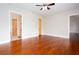 Empty bedroom with hardwood floors and 2 doors leading to different rooms at 281 Chilhoe Dr, Canton, GA 30115