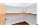 Walk-in closet with custom shelving and natural wood door at 281 Chilhoe Dr, Canton, GA 30115