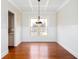 Dining room with coffered ceiling, wainscoting, hardwood floors and natural light at 281 Chilhoe Dr, Canton, GA 30115