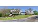 Inviting home with a charming front porch, porte-cochere and professionally landscaped front yard, creating curb appeal at 281 Chilhoe Dr, Canton, GA 30115