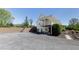 Two-story home exterior showcasing a large deck, patio, and basketball hoop at 281 Chilhoe Dr, Canton, GA 30115