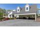 Beautiful home featuring a porte-cochere and a well-manicured front yard that enhances its curb appeal at 281 Chilhoe Dr, Canton, GA 30115