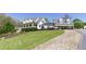 Inviting white home with a charming front porch and well-manicured lawn at 281 Chilhoe Dr, Canton, GA 30115