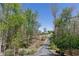 Distant view of a lovely farmhouse exterior with a long paved driveway at 281 Chilhoe Dr, Canton, GA 30115